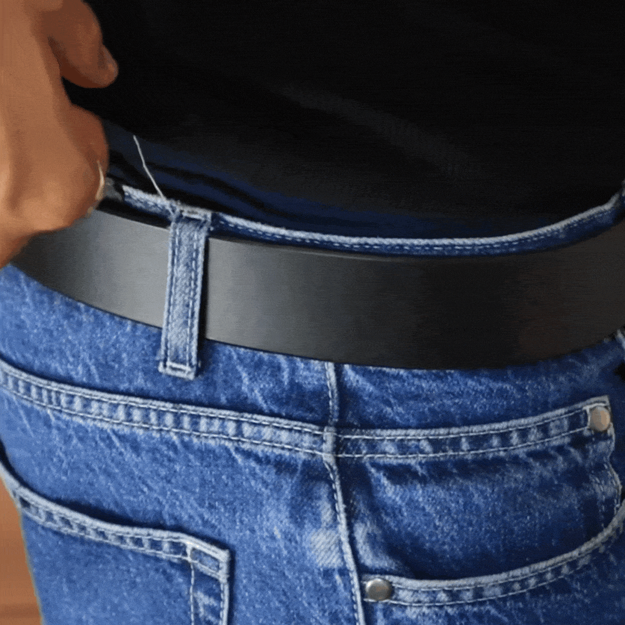 video of man turning around showing leather belt